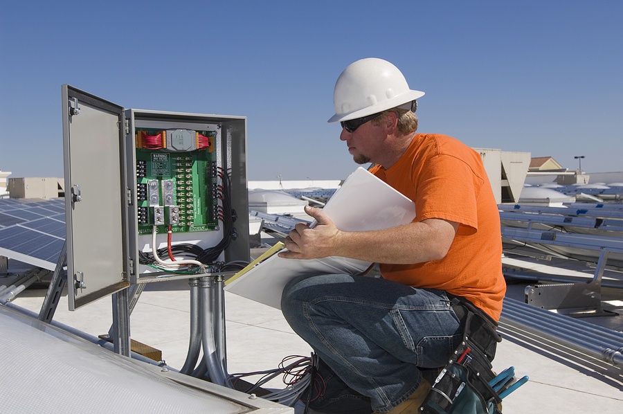 The Field Service Technician Vs The Field Service Engineer   Bigstock Electrical Engineer Holding Bo 48880103 