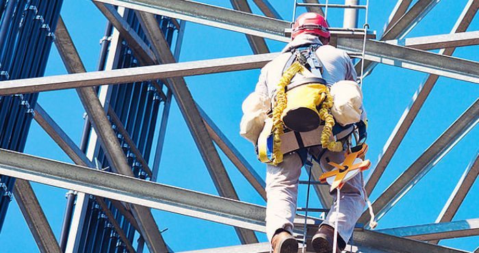 field tech climbing tower